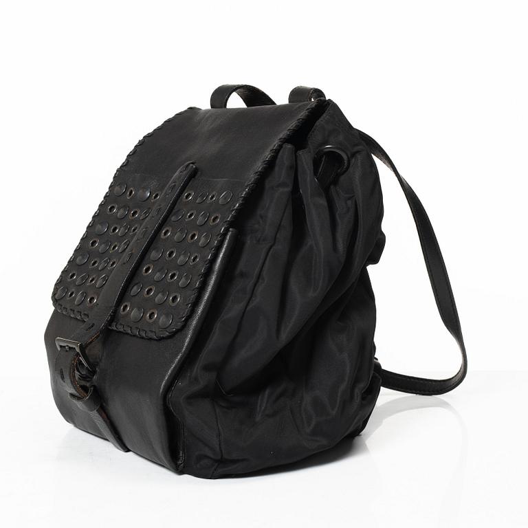 Prada, A nylon and leather backpack.