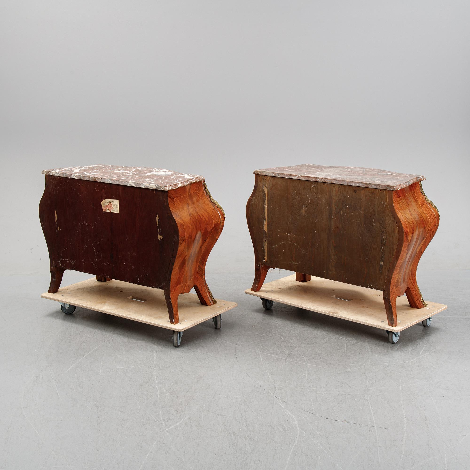 A pair of rococo style chest of drawers, mid 20th Century.