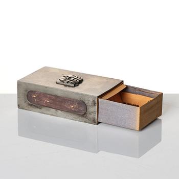 Firma Svenskt Tenn, a pewter matchbox case with beaker, models "38d" and "185a", with decor by Anna Petrus, Stockholm 1927-28.