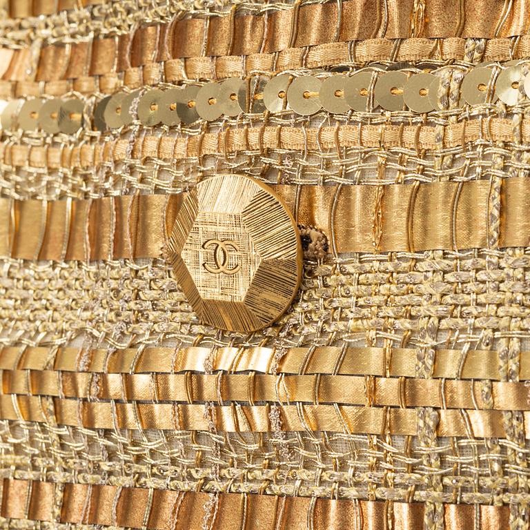 Chanel, a gold bouclé jacket, size 34.