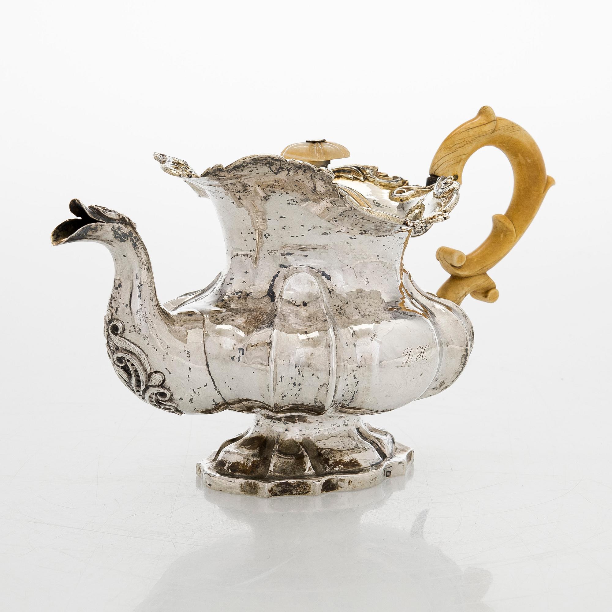 A parcel-gilt silver teapot, Moscow 1845.