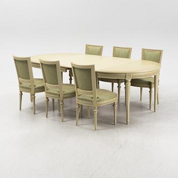 A Gustavian dining table with six chairs. Åmells dated 1974.