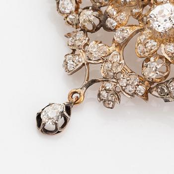 A silver brooch set with old-cut diamonds.