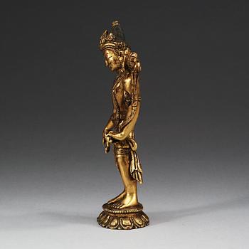 A gilt and stone-inlayed bronze figure of Tara, Nepal, 19th Century.