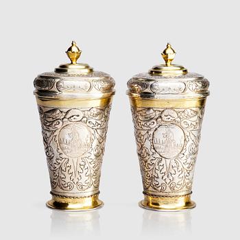 A pair of Russian Baroque parcel-gilt silver cups and covers, mark of Nikifor Timofeev, Moscow 1729.