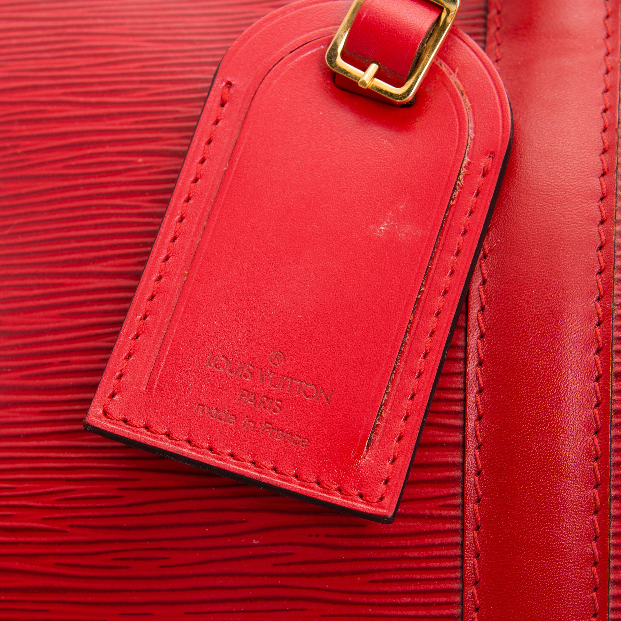 Louis Vuitton, A Red Epi Leather Keepall travel bag.