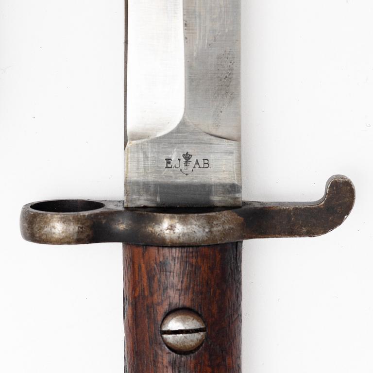 Three Swedish bayonets with scabbards.