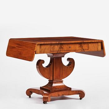 A Swedish Empire mahogany center table.