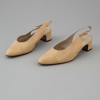 Beige leather slingbacks by Chanel.