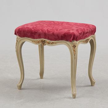 A mid 20th century Rococo style dressing table, a pair of bedside tables and one stool.