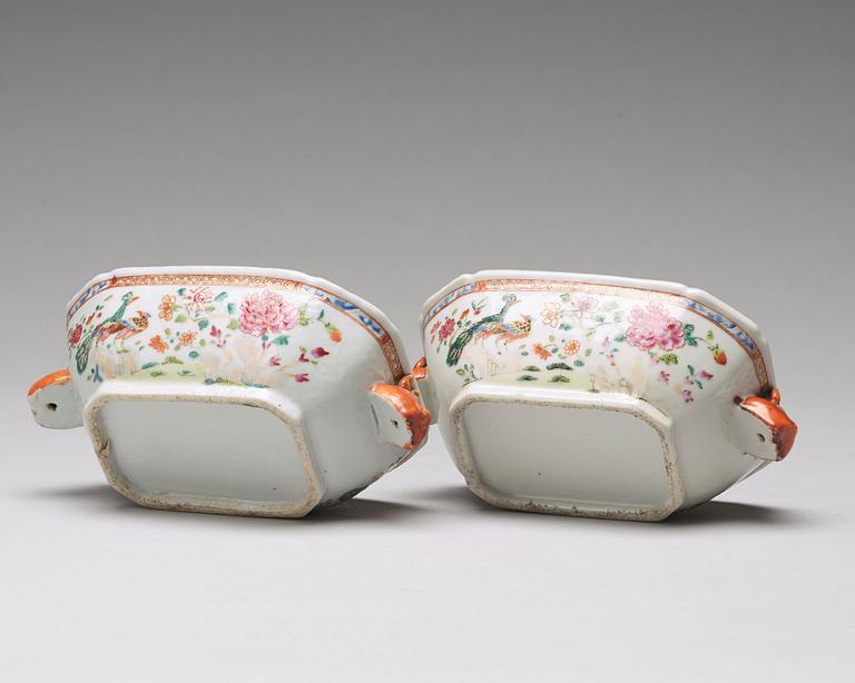 A pair of famille rose 'double peacock' butter tureens with covers and stands, Qing dynasty, Qianlong (1736-95).