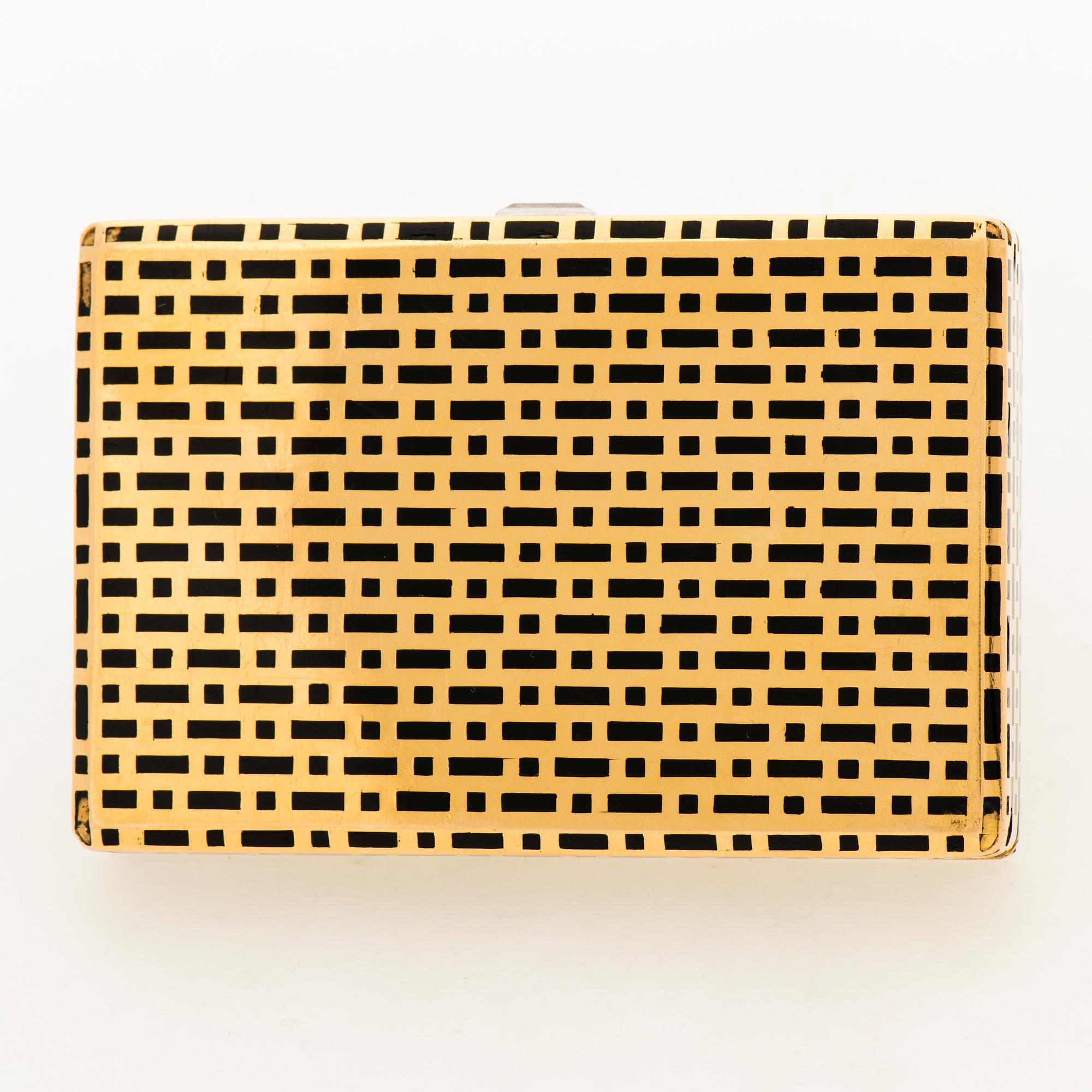 A CARTIER VANITY CASE, 18K gold, enamel, baguette cut diamond. France 1930s.