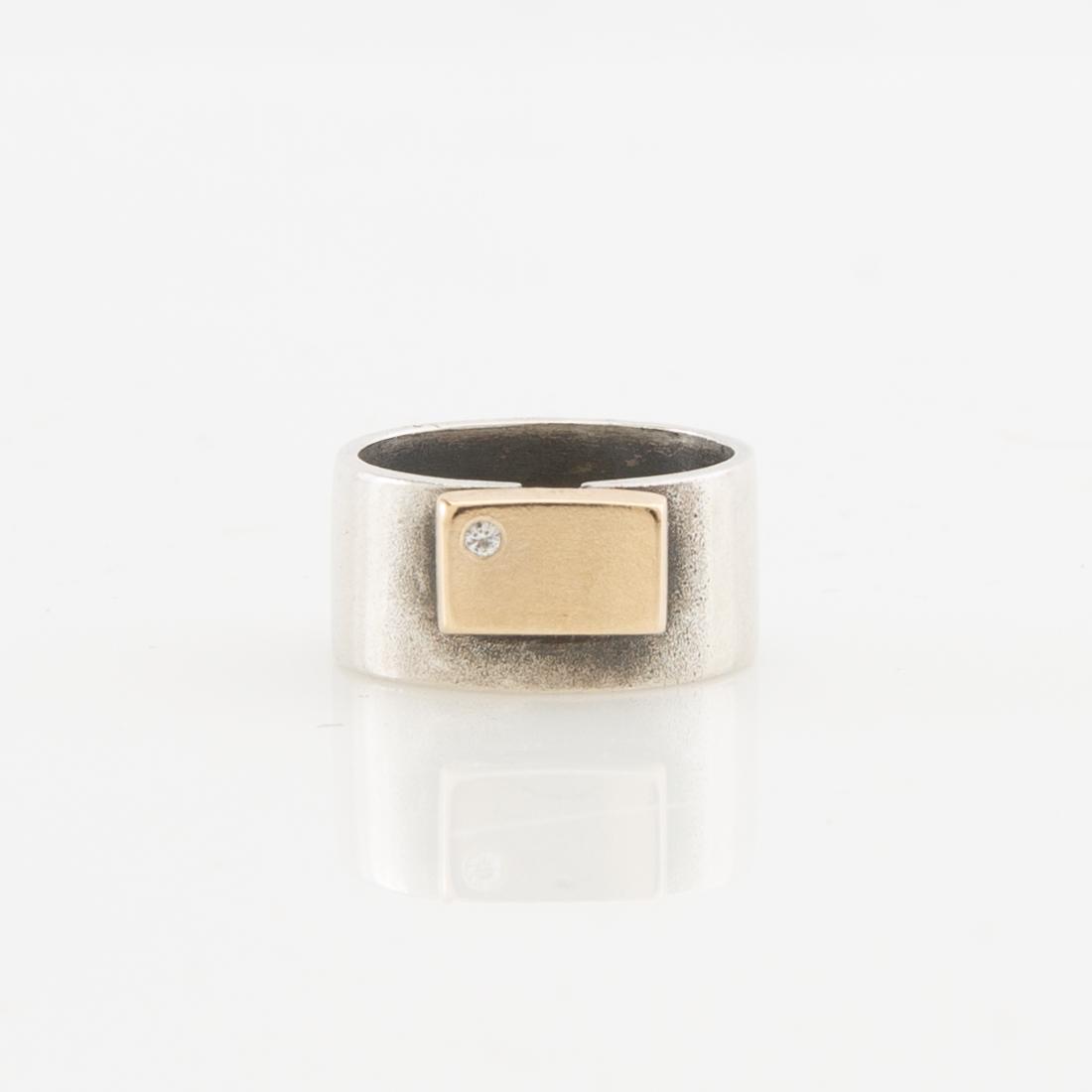Claes Liljeroth, Ring of silver and 18K gold set with a round brilliant-cut diamond.