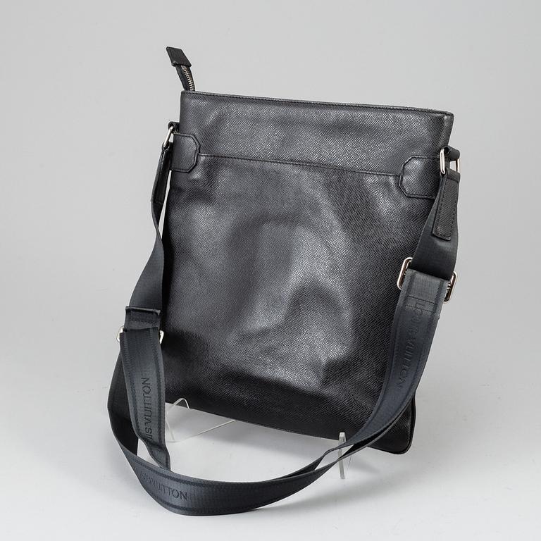 LOUIS VUITTON, a black Taiga bag, 2012.