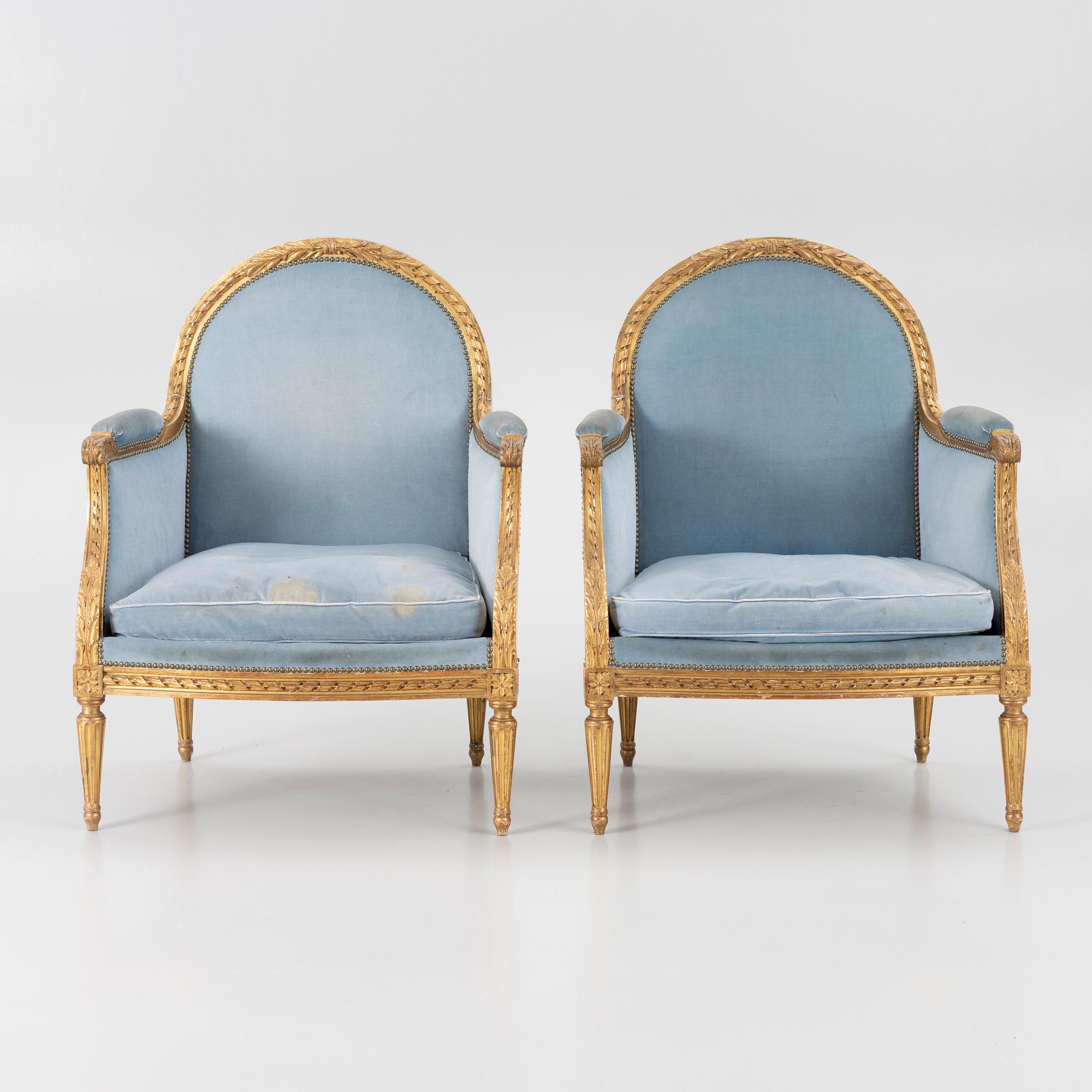 A pair of easy chairs, Louis XVI style, 20th century.