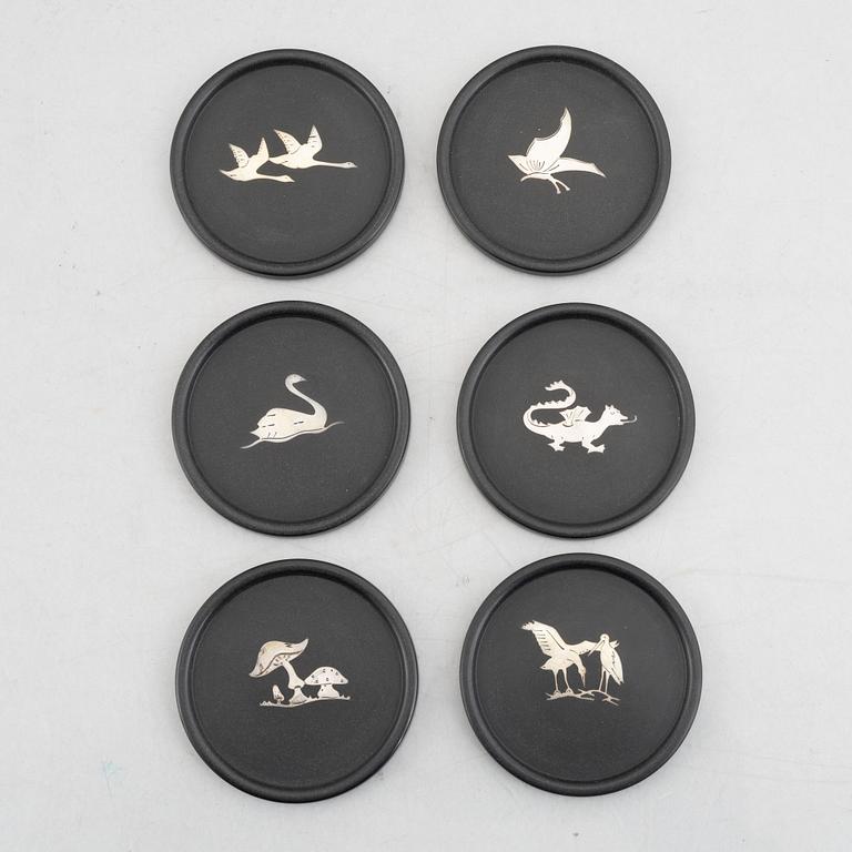 Coasters, 8 st, isolit med silverinläggningar, 1937-53.