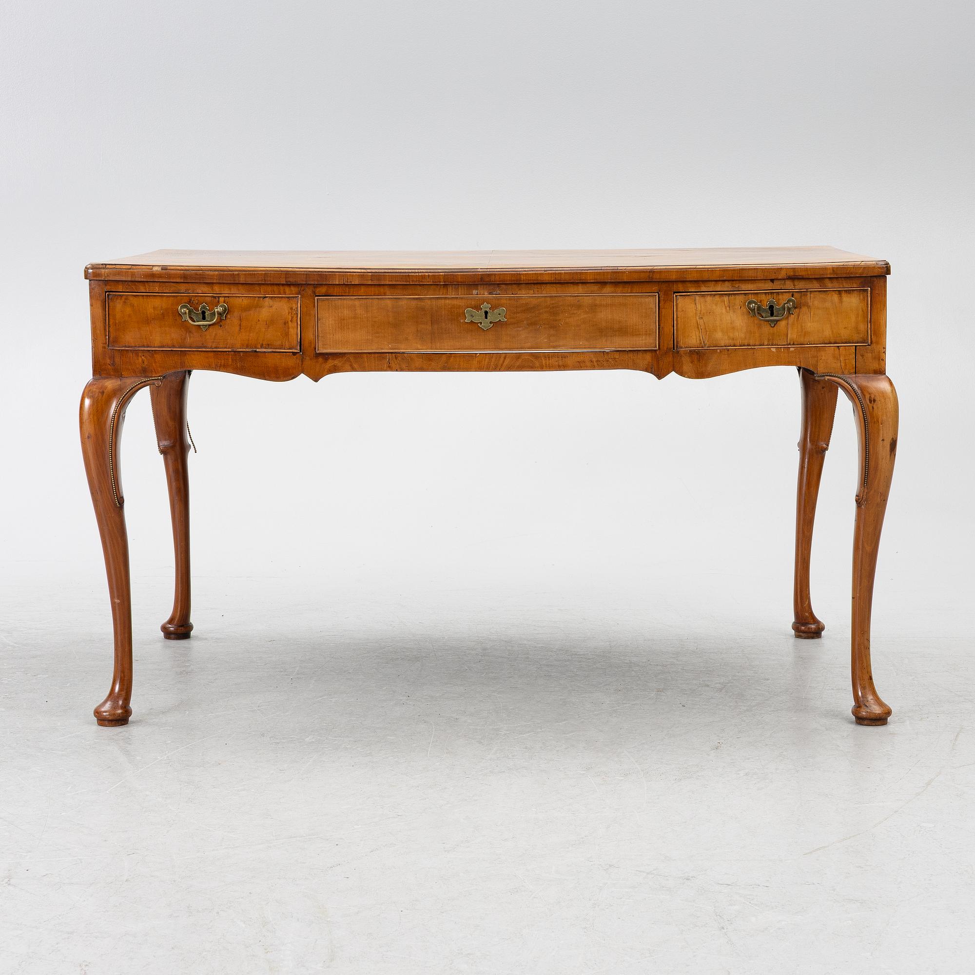 A George II walnut partner's desk, mid 18th century.