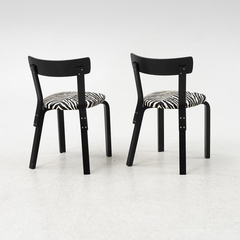 Alvar Aalto, a dining table and eight chairs, model 69, Artek, Finland, end of the 20th century.
