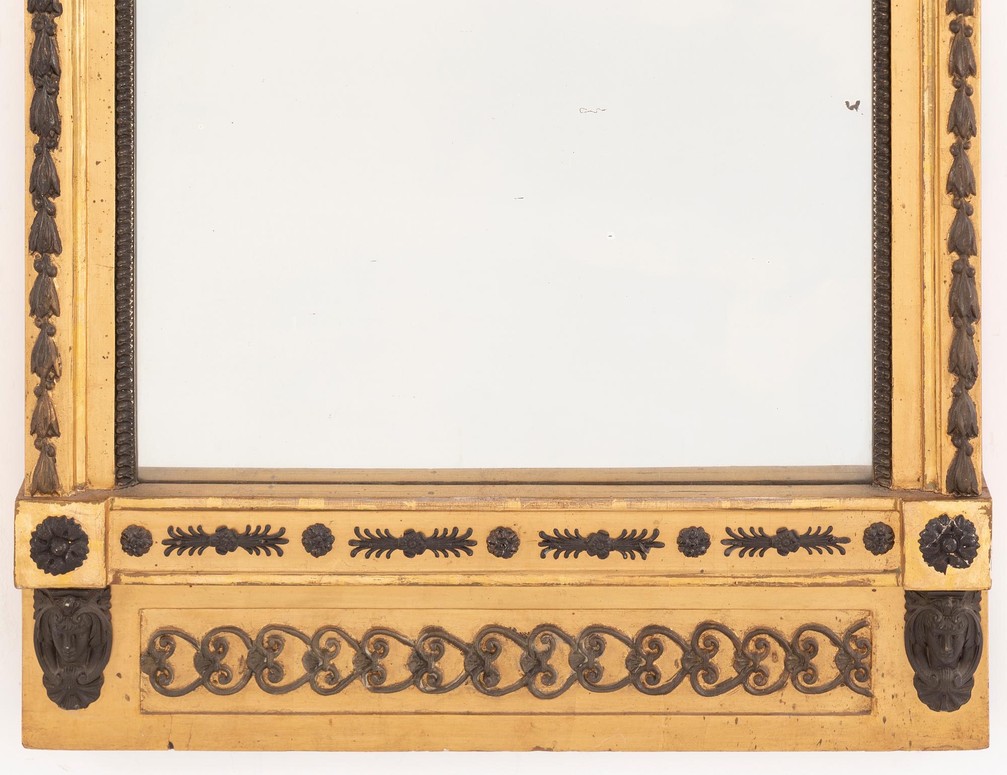 A Gustavian mirror, signed Hedberg & Lindblad, Stockholm, early 19th Century.