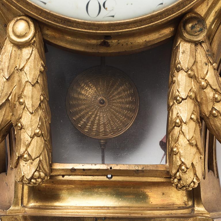 A Louis XVI gilt bronze wall clock by Jean Joseph Léonard Roque, active 1770-89.