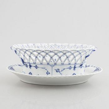 A Royal Copenhagen 'musselmalet full lace' chesnut basket with stand, (1889-1922). 1057.