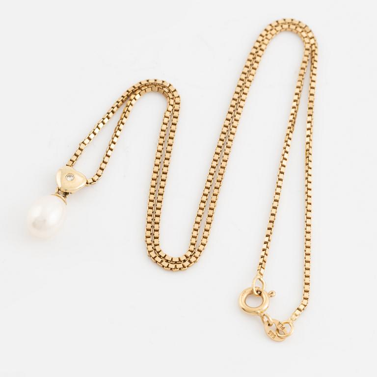 Cultured pearl and heart with small brilliant cut diamond necklace.