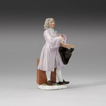 A Meissen porcelain figure of a trinket salesman from the series of Parisian street-traders, circa 1745.