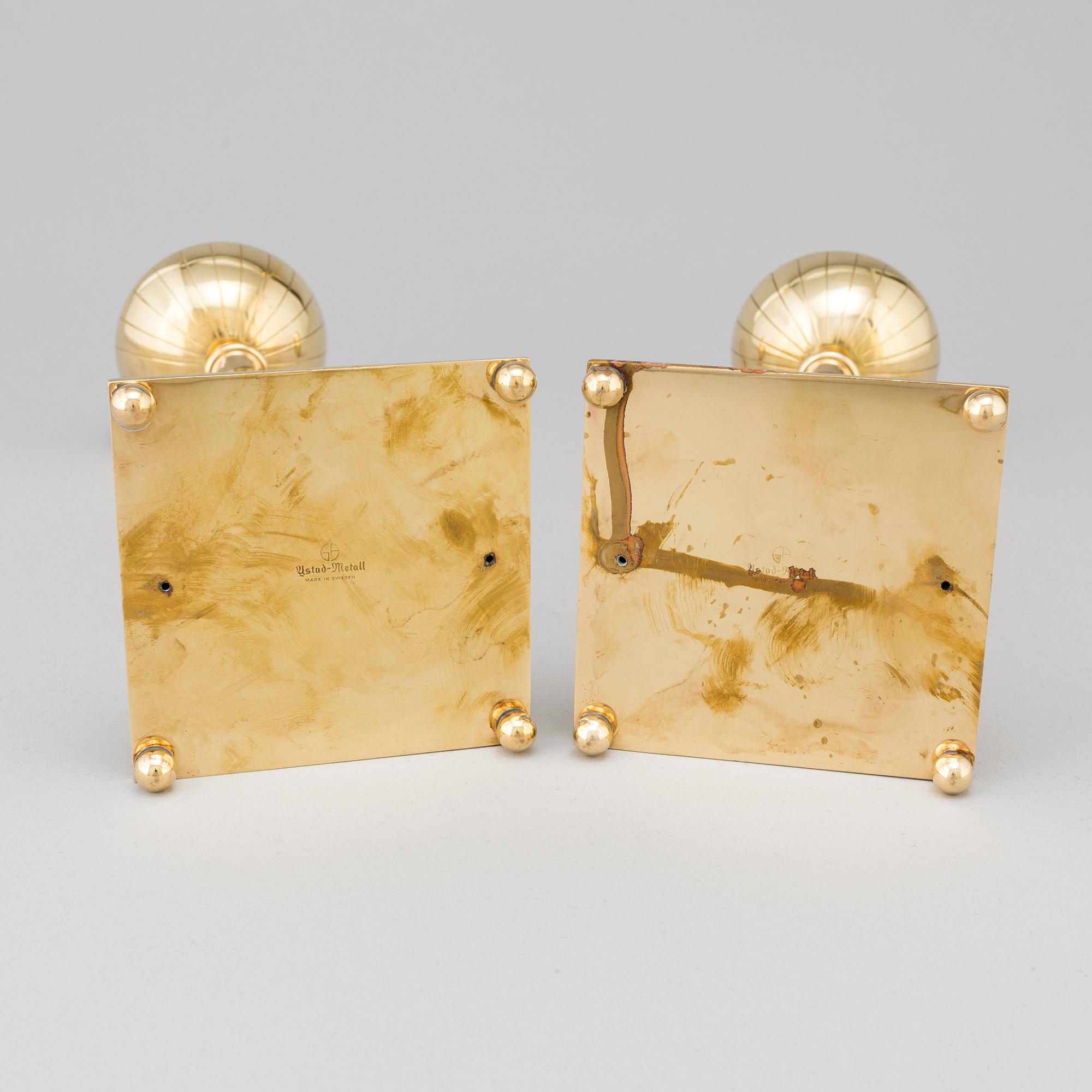 A pair of mid 20th century brass candlesticks by Gunnar Ander for Ystad Metall.