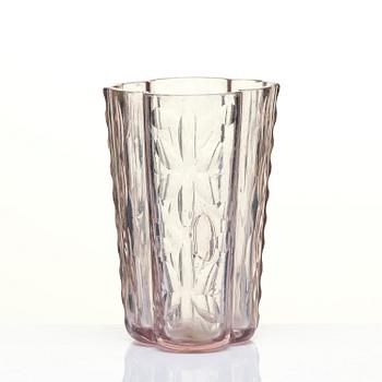 An amethyst coloured suger shaker and a cut glass goblet, 18th century.