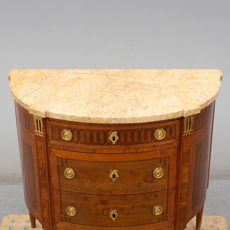 A Louis XVI-style 20th century commode.