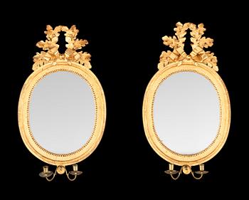 717. A pair of Gustavian two-light girandole mirrors by N. Meunier.