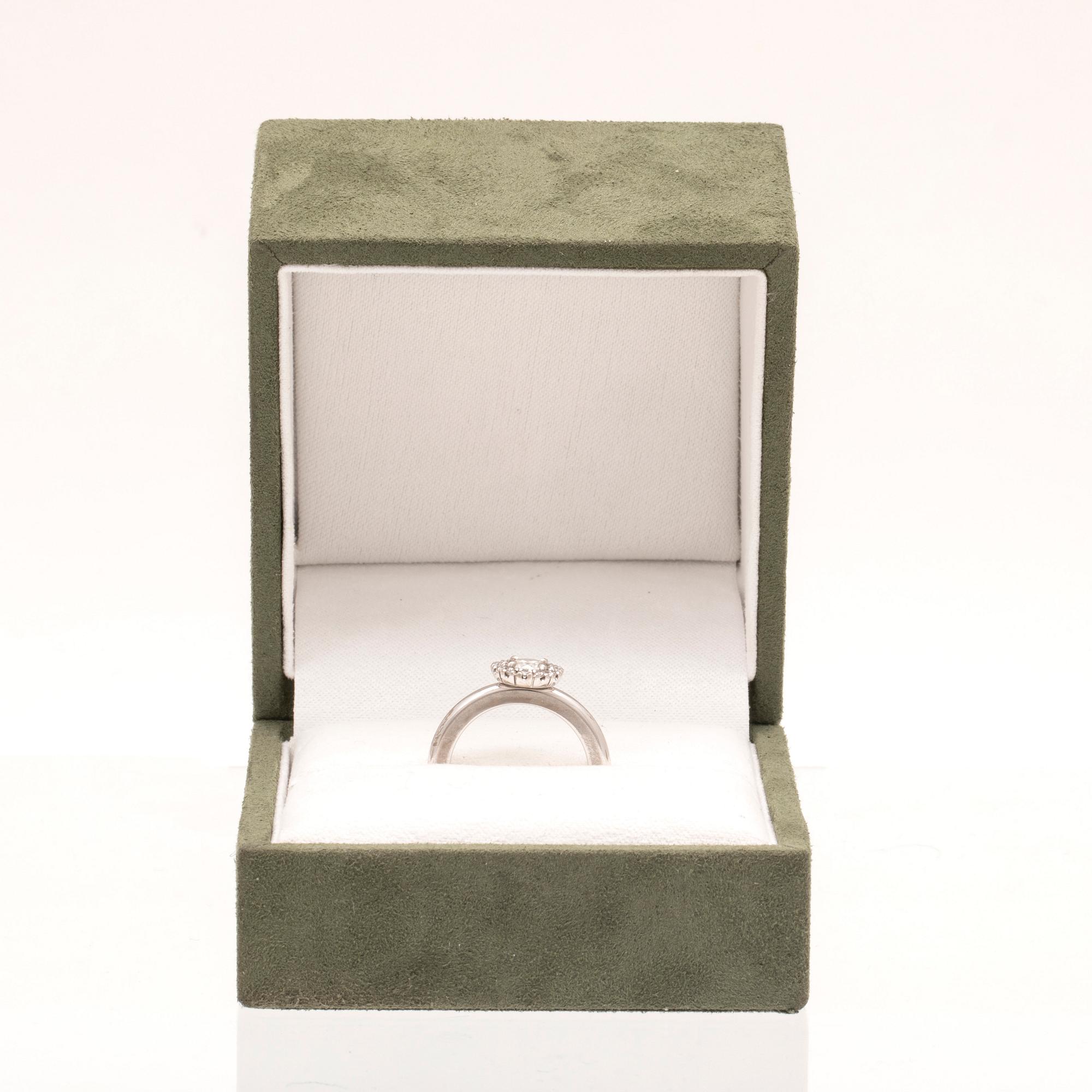 An 18K white gold ring with round brilliant cut diamonds by Engelbert, with GIA dossier.