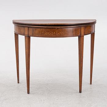 A mahogany-veneered table, presumably Denmark, Empire, first half of the 19th century.