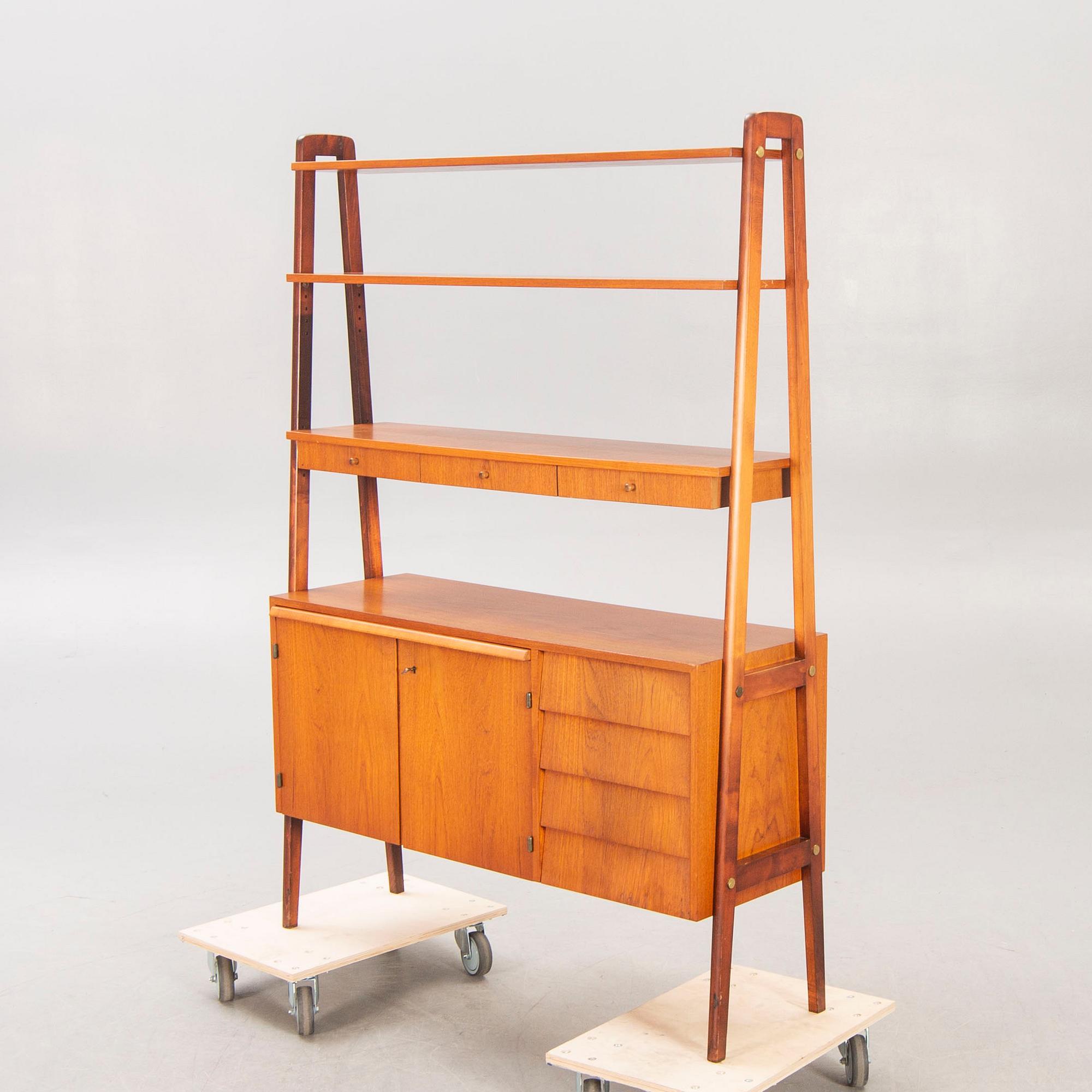 A teak mid 1900s book shelf.