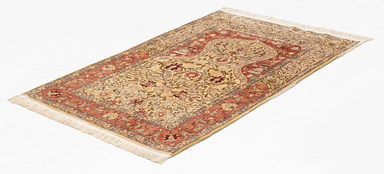 A silk Hereke, rug, ca 103 x 73 cm.