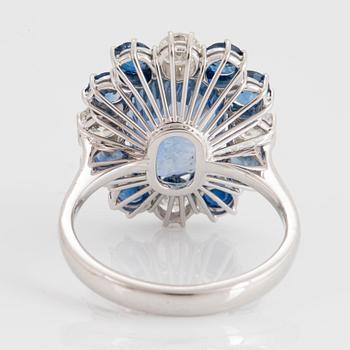 An 18K white gold ring set with a cushion shaped faceted sapphire 5.91 cts.