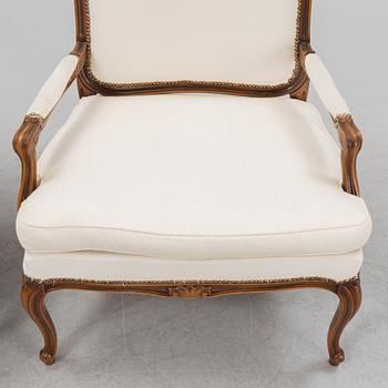 A pair of Rococo style armchairs, later part of the 20th century.