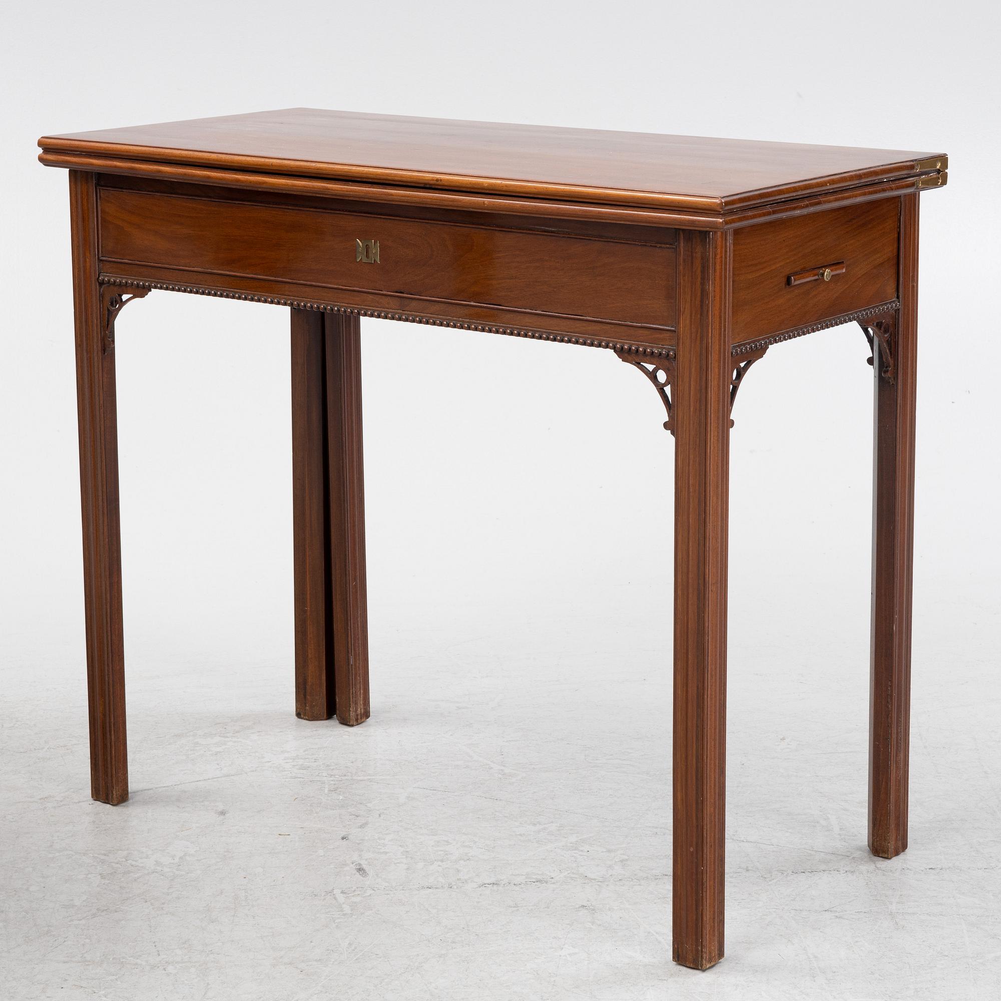 A macthed pair of late Gustavian mahogany veneered card tables one by C D Fick, Stockholm 1776-1806.