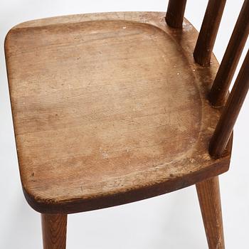 Axel Einar Hjorth, a set of four stained pine "Utö" chairs, Nordiska Kompaniet, Sweden 1930s.