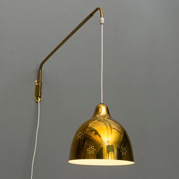 A mid 20th century wall light for Stockmann Orno, Finland.