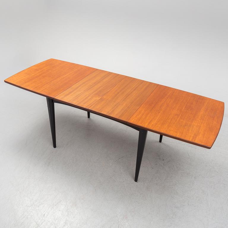 A 1950s/1960s teak and teak veneer table.