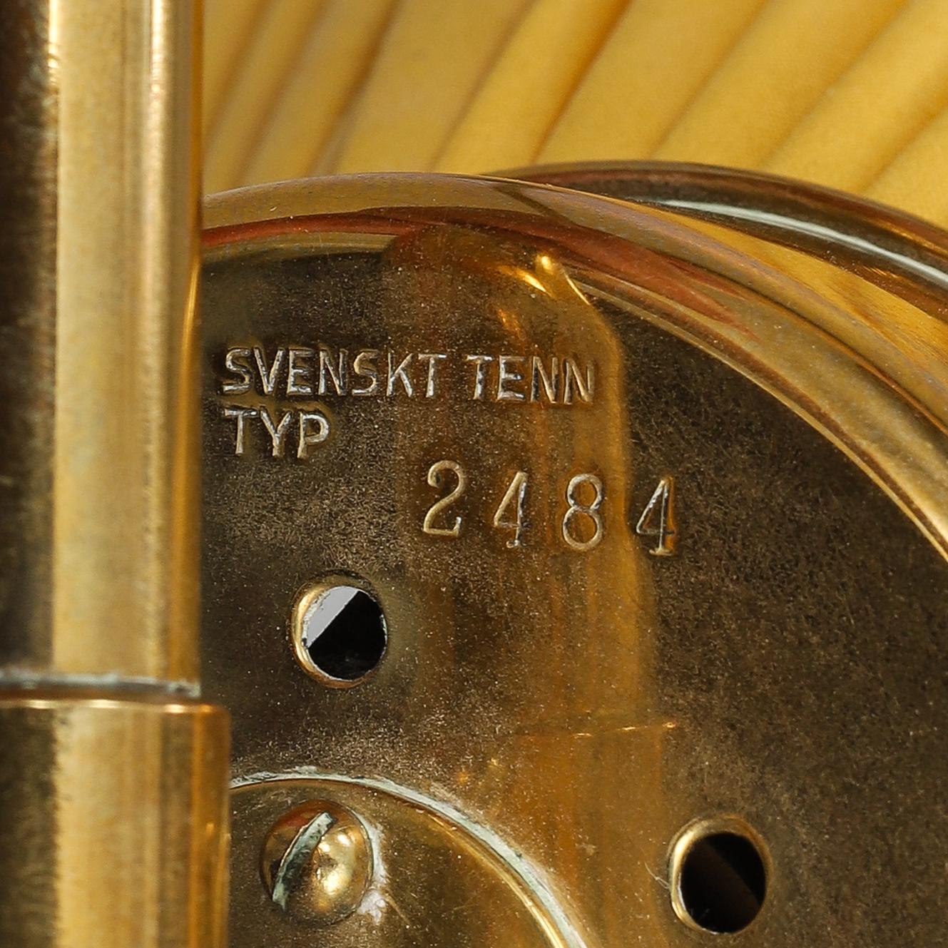 A model 2484 brass wall light by Josef Frank for Firma Svenskt Tenn.