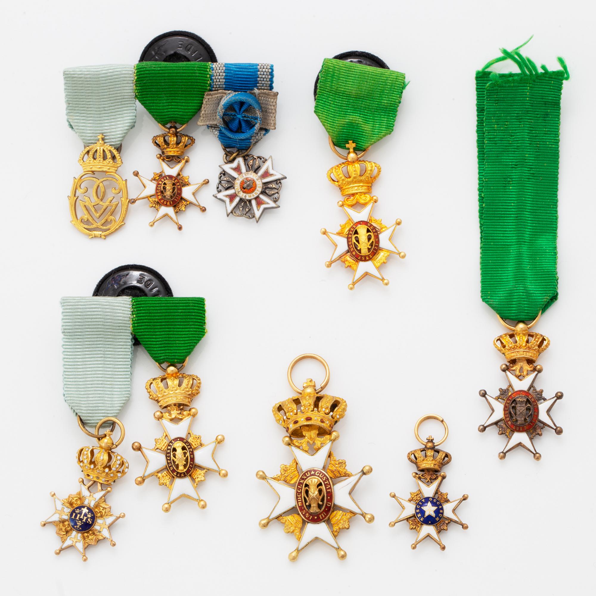 A group of miniature decorations, mostly Swedish.