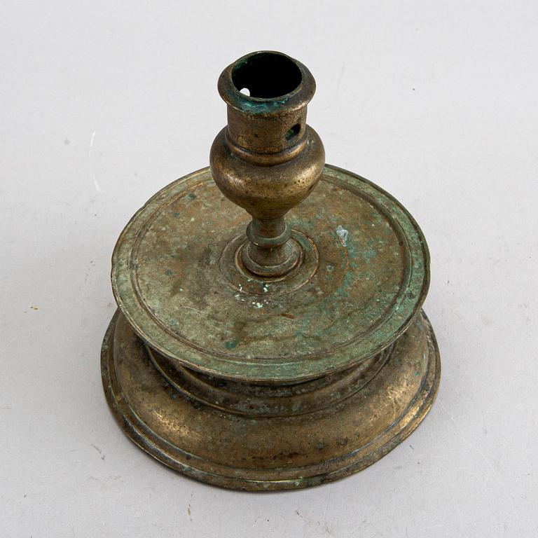 A BAROQUE BRASS CANDLESTICK, 18th century.