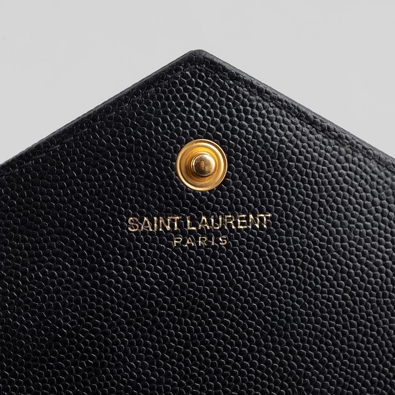 Yves Saint Laurent, a handbag/clutch.