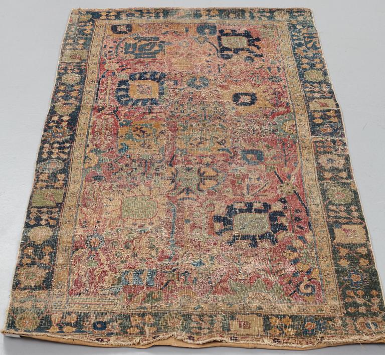 CARPET FRAGMENTS, an antique Kerman Vase-carpet, the beginning of the 18th century, ca 193,5 x 103,5 cm.