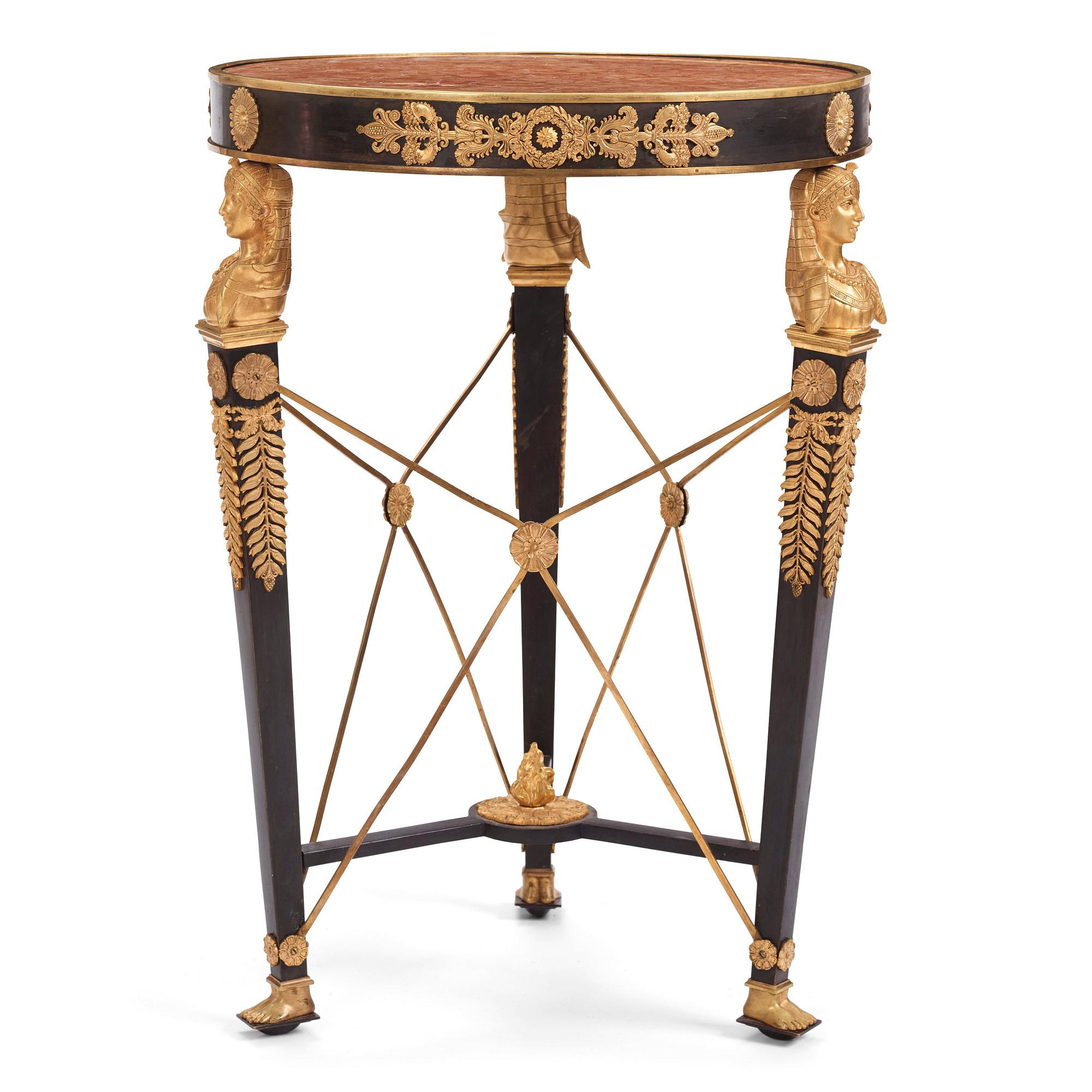 A French Empire-style gilt and patinated bronze  gueridon, later part of the 19th century.