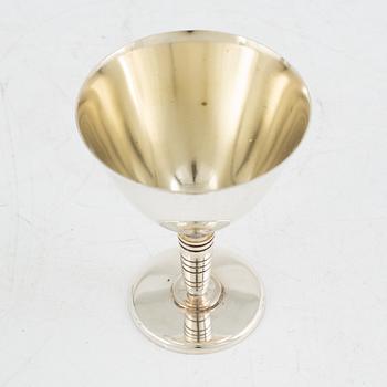 Folke Arström, eight silver plate cocktail glasses and a shaker, GAB.