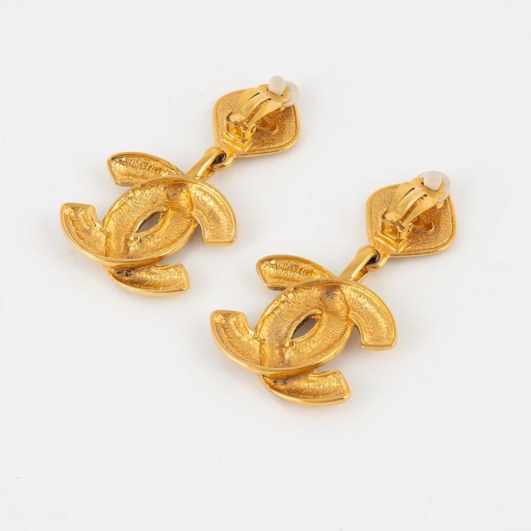 Chanel, a pair of gold tone clip-on earrings, 1990-1992.