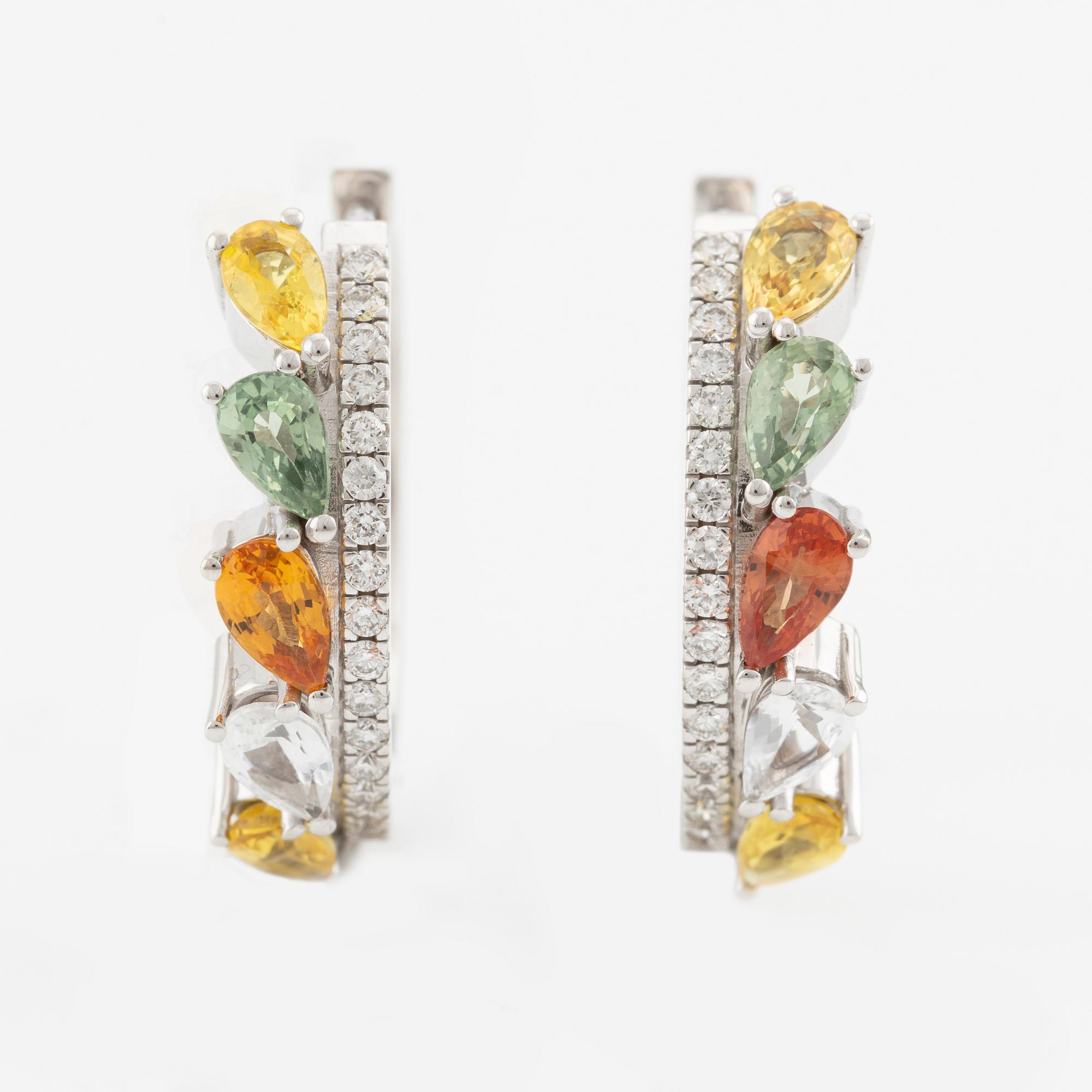 A pair of 14K gold earrings with multicoloured sapphires and diamonds.